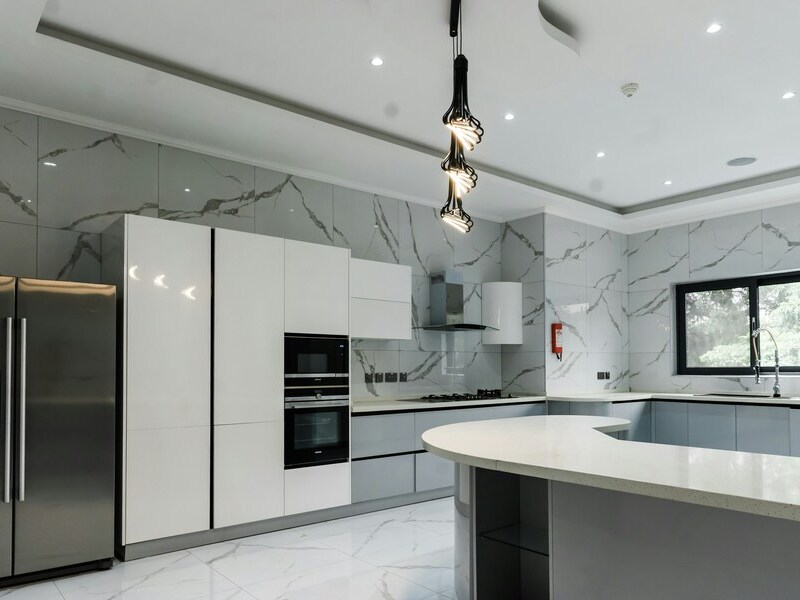 Bright, impeccably clean modern kitchen with marble finishes β Lady Moon Cleaning